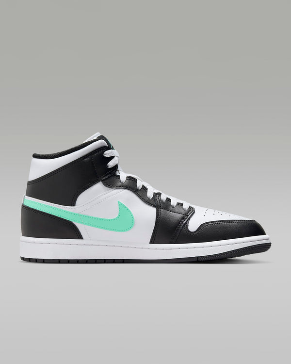 Mid-top sneaker inspired by the original Air Jordan 1, featuring iconic design elements, unique color choices, and crisp leather for a distinct and stylish identity.