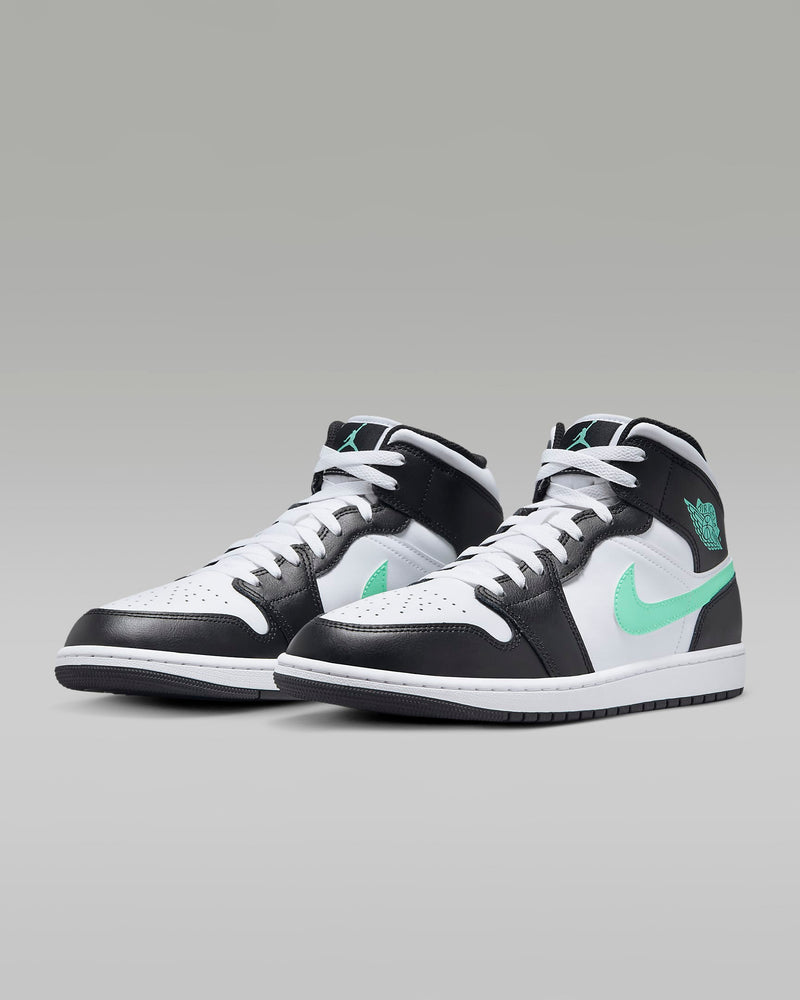 Mid-top sneaker inspired by the original Air Jordan 1, featuring iconic design elements, unique color choices, and crisp leather for a distinct and stylish identity.