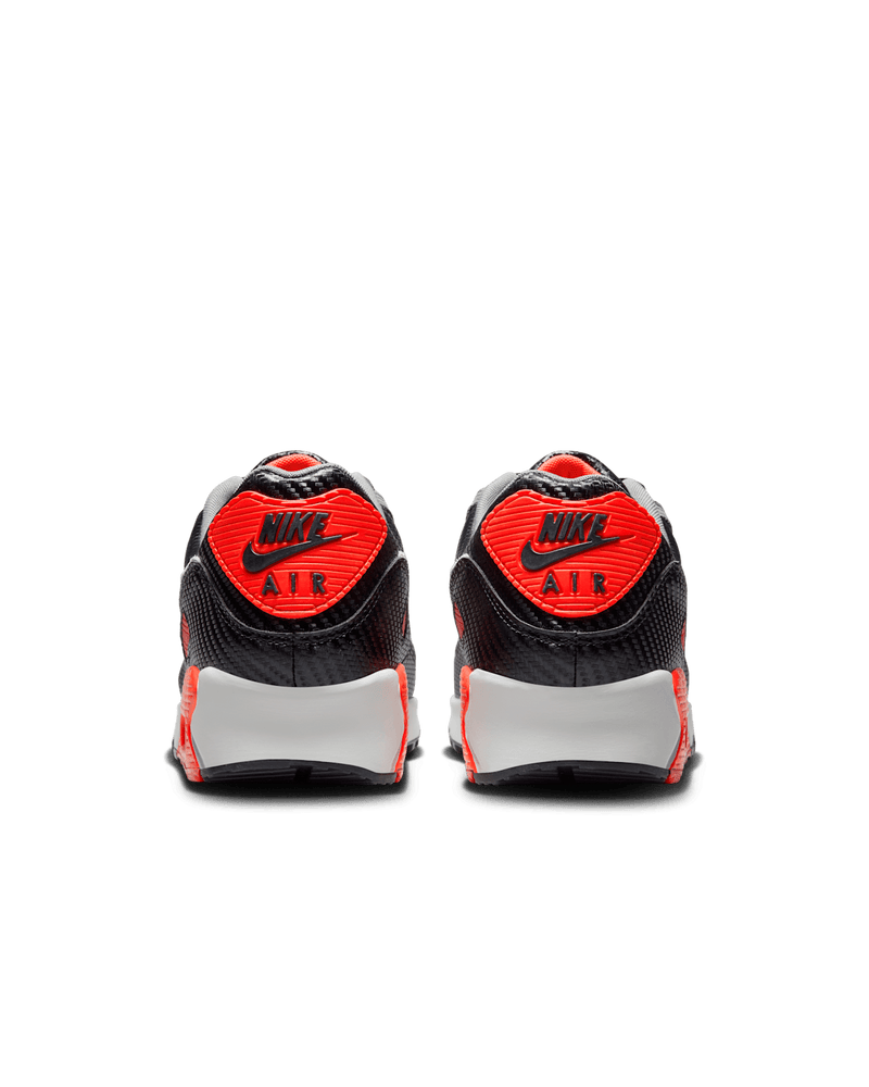 Nike Air Max 90 shoes with Cool Grey leather upper, Bright Crimson accents, black mudguard, and visible Max Air unit