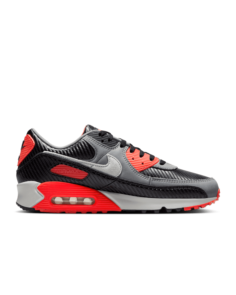Nike Air Max 90 shoes with Cool Grey leather upper, Bright Crimson accents, black mudguard, and visible Max Air unit