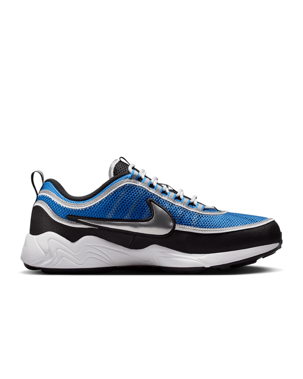 Air Zoom Spiridon sneakers with black, Signal Blue, and University Red colorway, reflective piping, and breathable mesh upper.