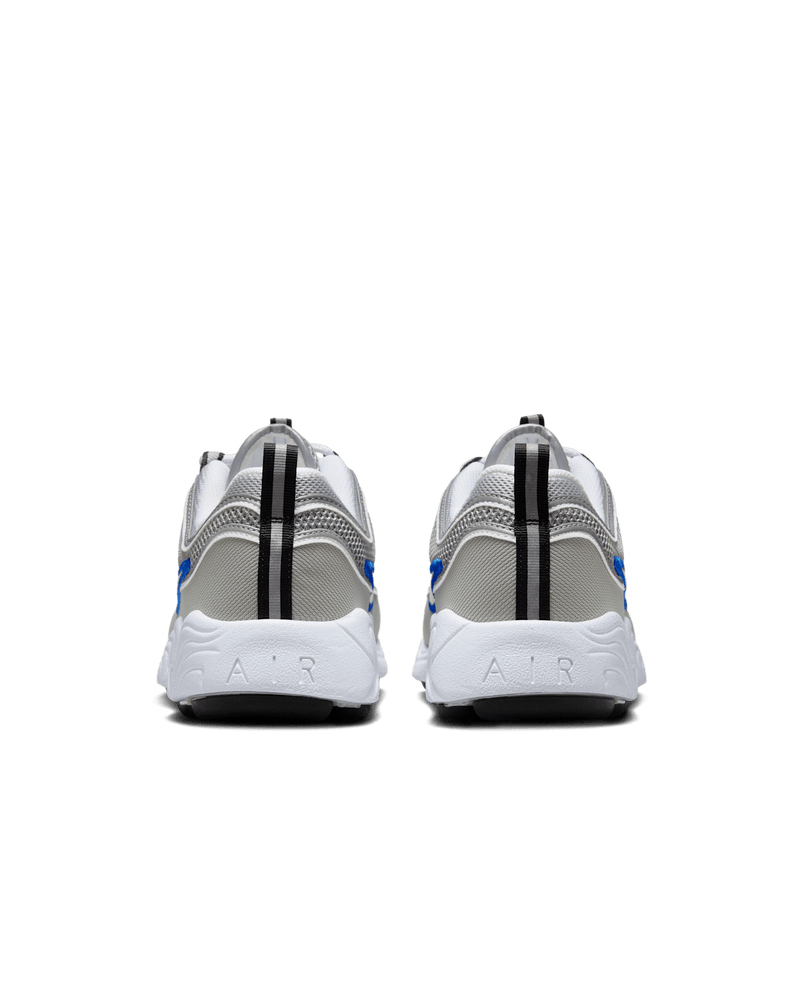Air Zoom Spiridon retro sneaker with reflective design piping, airy mesh upper, full-length Air Zoom cushioning, and Metallic Silver and Signal Blue colorway.