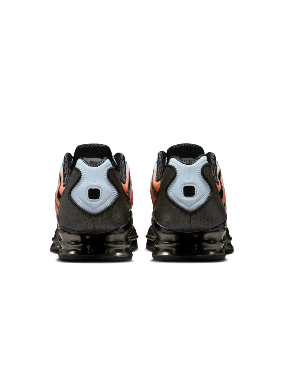 Nike Shox TL sneaker featuring a breathable mesh upper and full-length Shox cushioning in a bold, street-ready design.