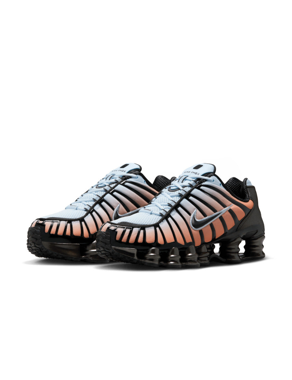 Nike Shox TL sneaker featuring a breathable mesh upper and full-length Shox cushioning in a bold, street-ready design.