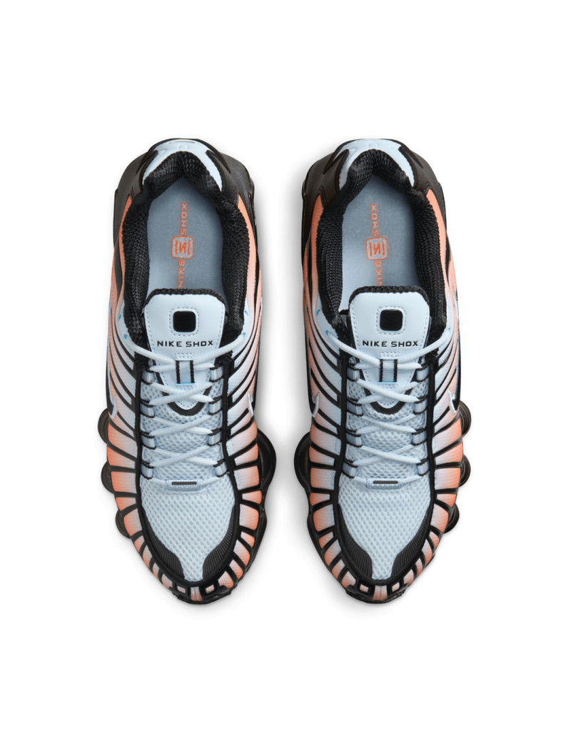 Nike Shox TL sneaker featuring a breathable mesh upper and full-length Shox cushioning in a bold, street-ready design.