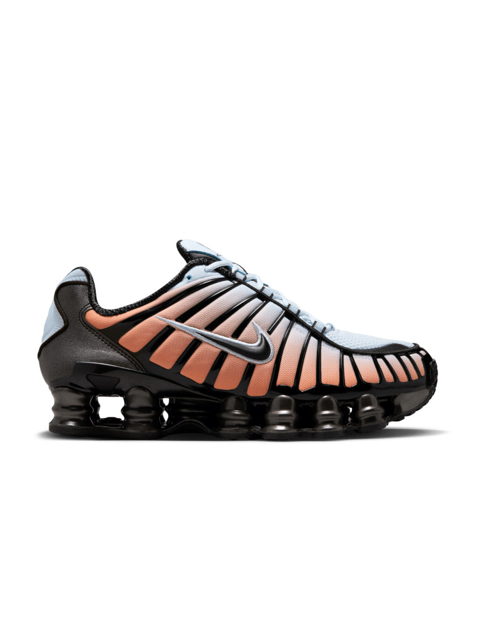 Nike Shox TL sneaker featuring a breathable mesh upper and full-length Shox cushioning in a bold, street-ready design.
