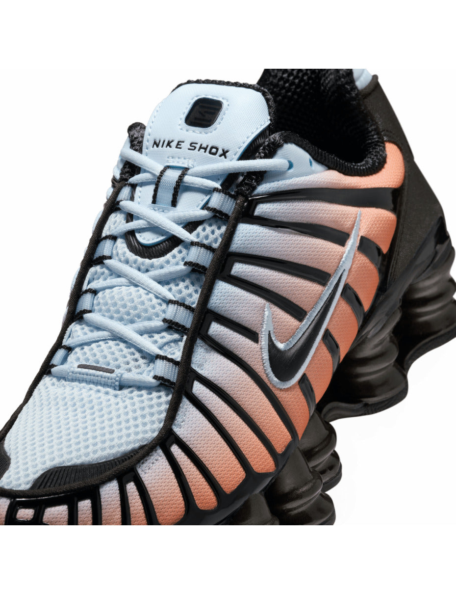 Nike Shox TL sneaker featuring a breathable mesh upper and full-length Shox cushioning in a bold, street-ready design.