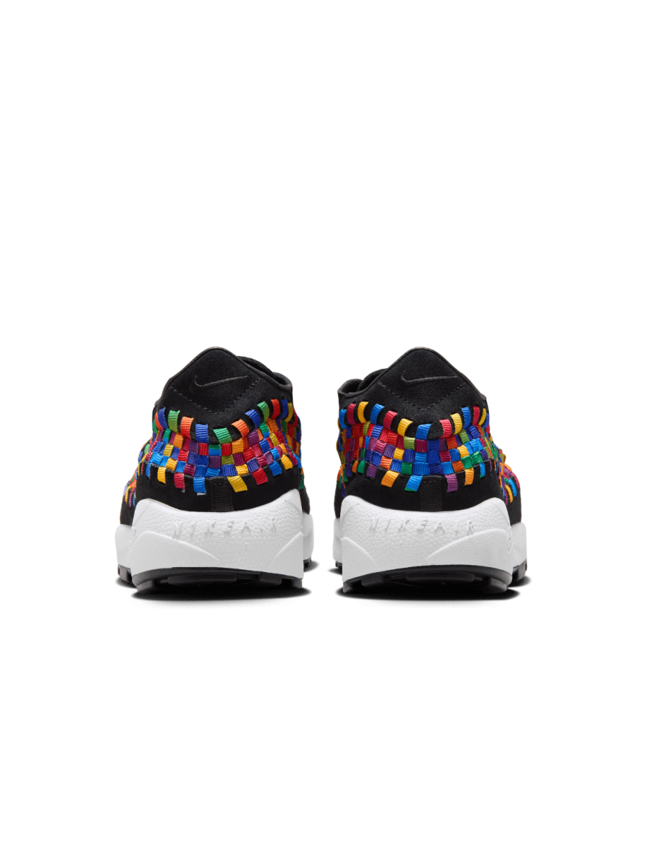 Comfy classic Footscape in vibrant colorway, showcasing wide toe box and asymmetrical woven details on black suede upper.