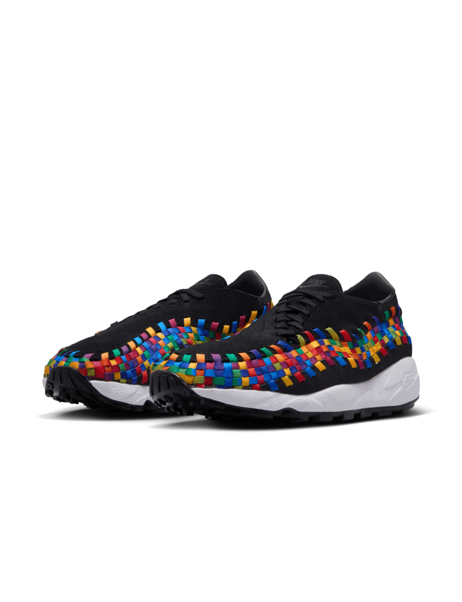 Comfy classic Footscape in vibrant colorway, showcasing wide toe box and asymmetrical woven details on black suede upper.