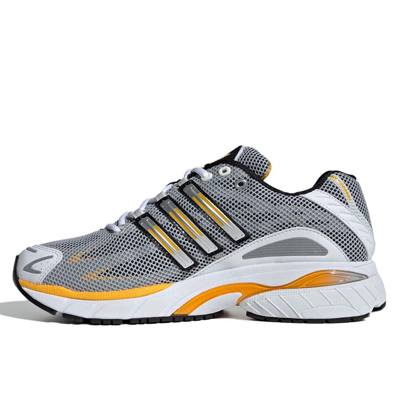 Adidas Adistar Cushion Shoes with breathable mesh upper, Adiprene cushioning, and metallic reflective details, combining retro style with modern comfort.