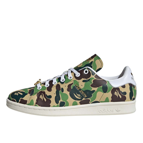 Adidas Stan Smith shoes in collaboration with BAPE, featuring a flexible upper with a bold stylized camo print for a striking look. 