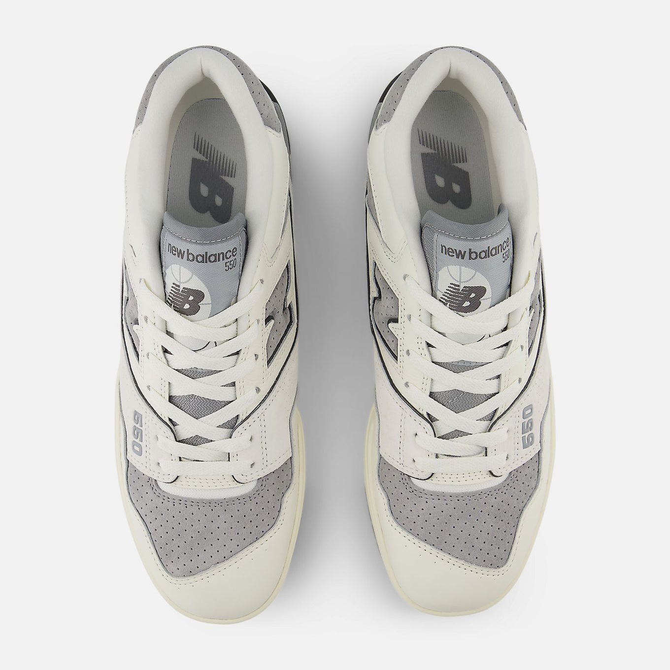 New Balance 550 sneakers featuring a low-top silhouette with leather, synthetic, and mesh upper in a retro basketball design