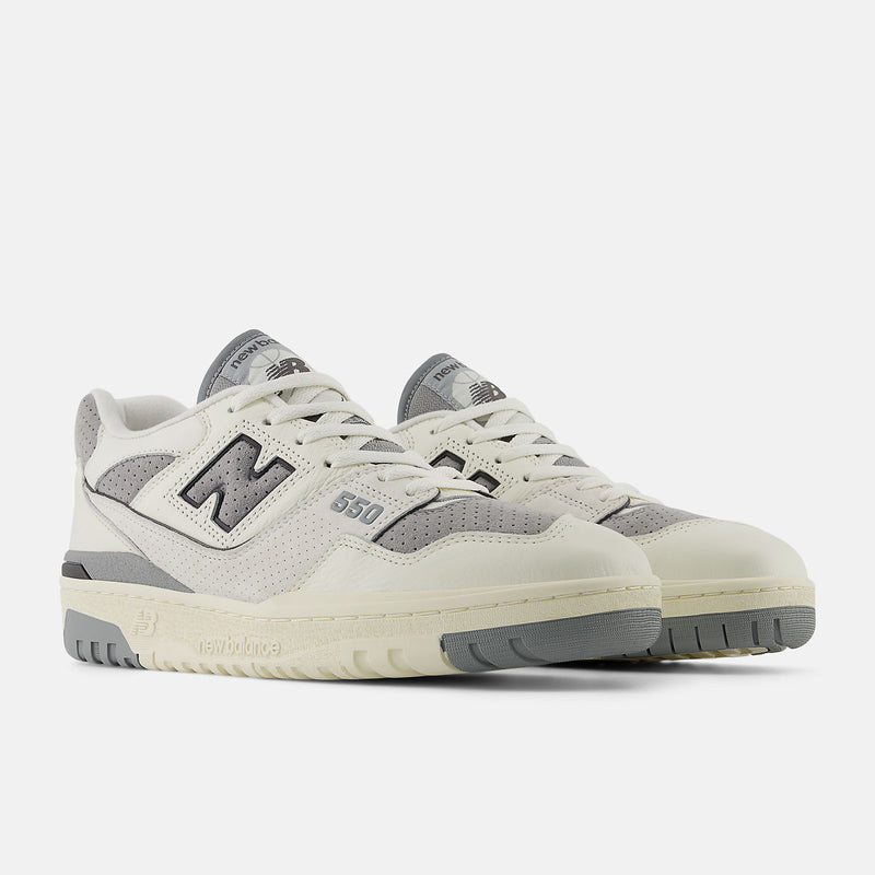 New Balance 550 sneakers featuring a low-top silhouette with leather, synthetic, and mesh upper in a retro basketball design
