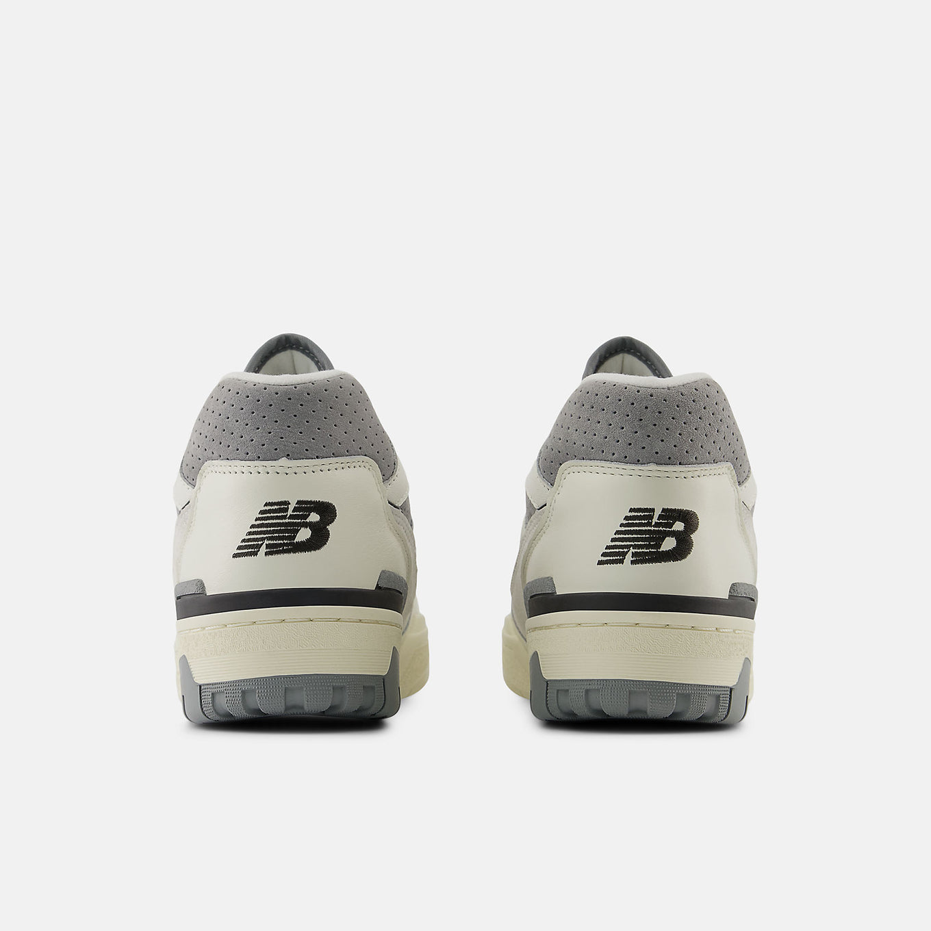 New Balance 550 sneakers featuring a low-top silhouette with leather, synthetic, and mesh upper in a retro basketball design