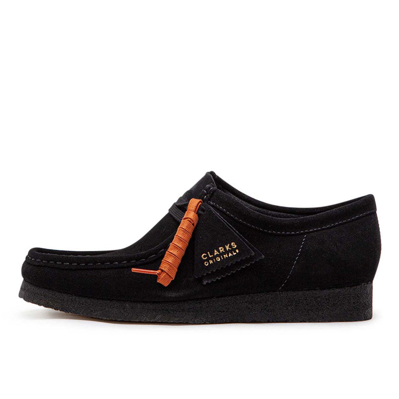 Clarks Wallabee in black suede with a structured moccasin design and lace-up closure.