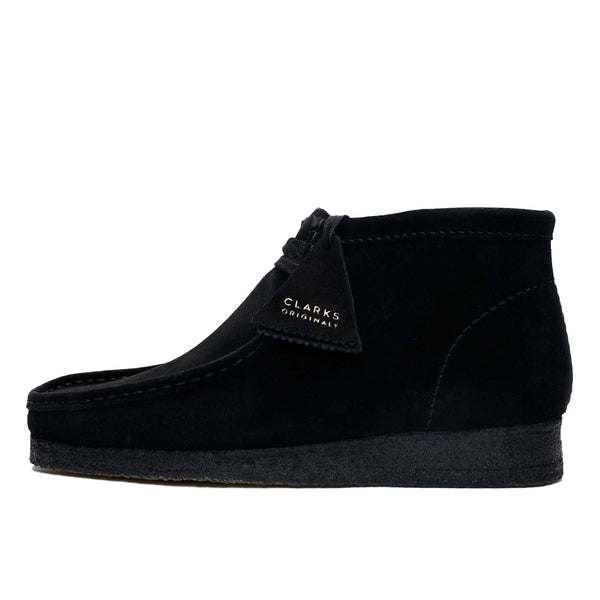 Clarks Wallabee in black suede with a structured moccasin design and signature crepe sole.