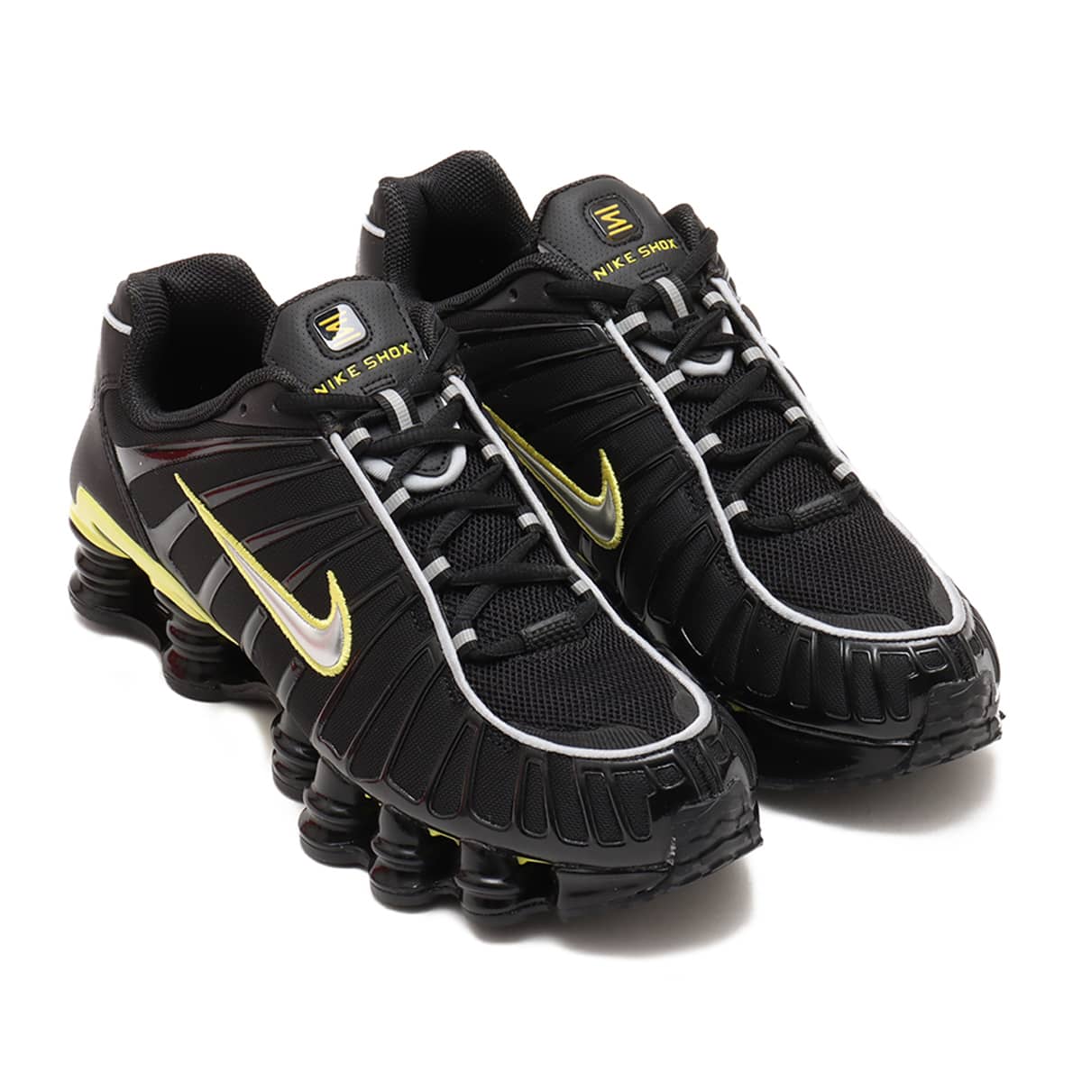 Nike Shox TL sneaker with breathable nylon mesh upper, plastic overlays, full-length Shox cushioning, and TPU plate for stability and support.