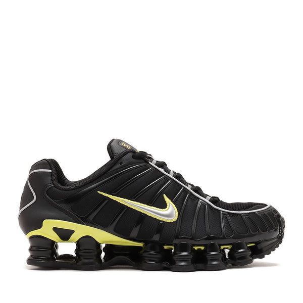 Nike Shox TL sneaker with breathable nylon mesh upper, plastic overlays, full-length Shox cushioning, and TPU plate for stability and support.