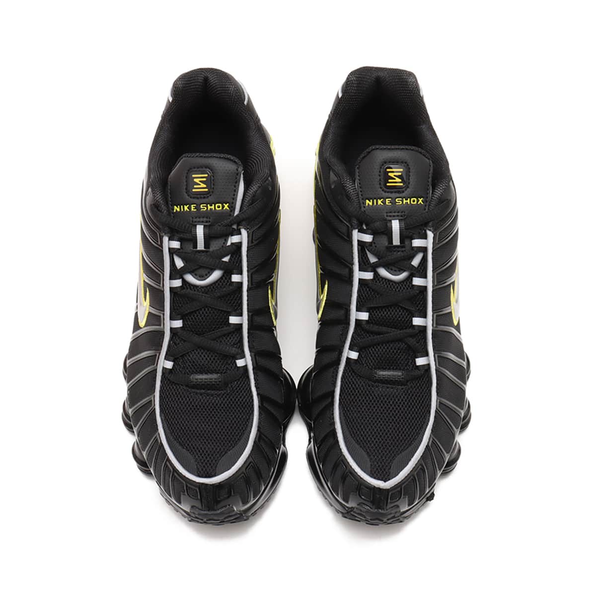 Nike Shox TL sneaker with breathable nylon mesh upper, plastic overlays, full-length Shox cushioning, and TPU plate for stability and support.