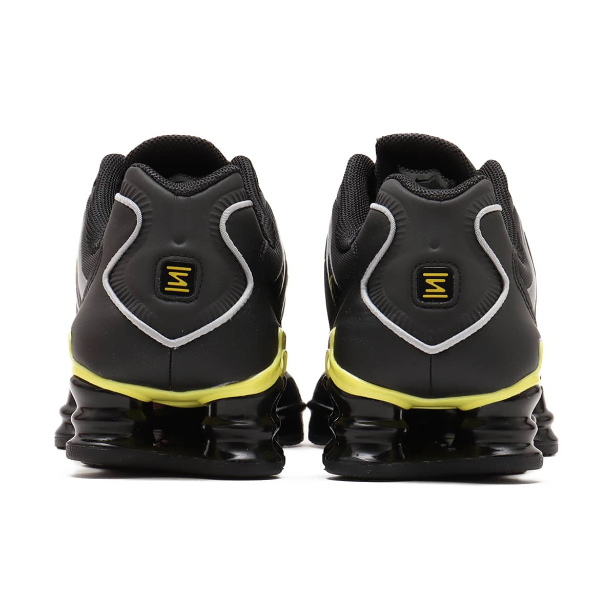 Nike Shox TL sneaker with breathable nylon mesh upper, plastic overlays, full-length Shox cushioning, and TPU plate for stability and support.