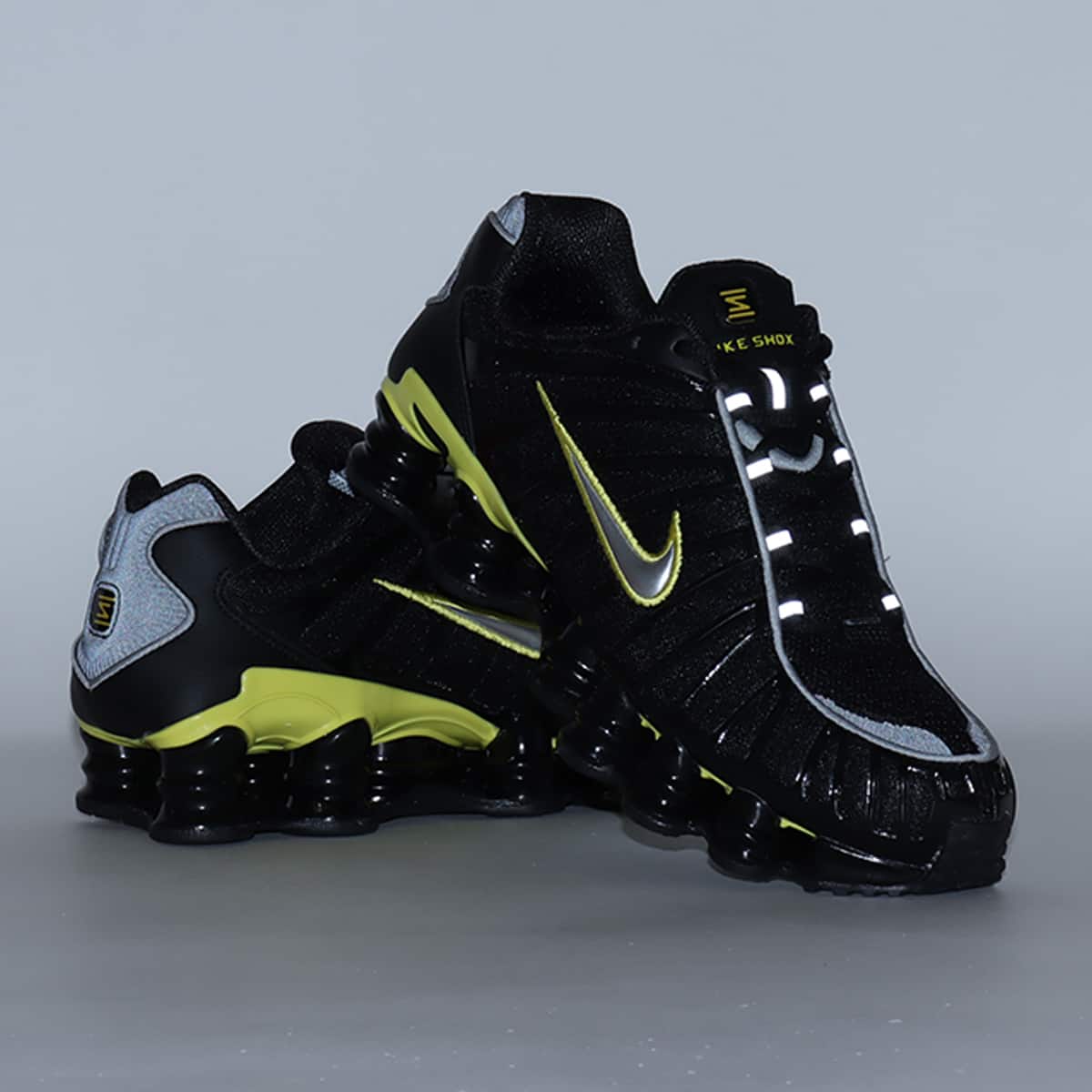 Nike Shox TL sneaker with breathable nylon mesh upper, plastic overlays, full-length Shox cushioning, and TPU plate for stability and support.