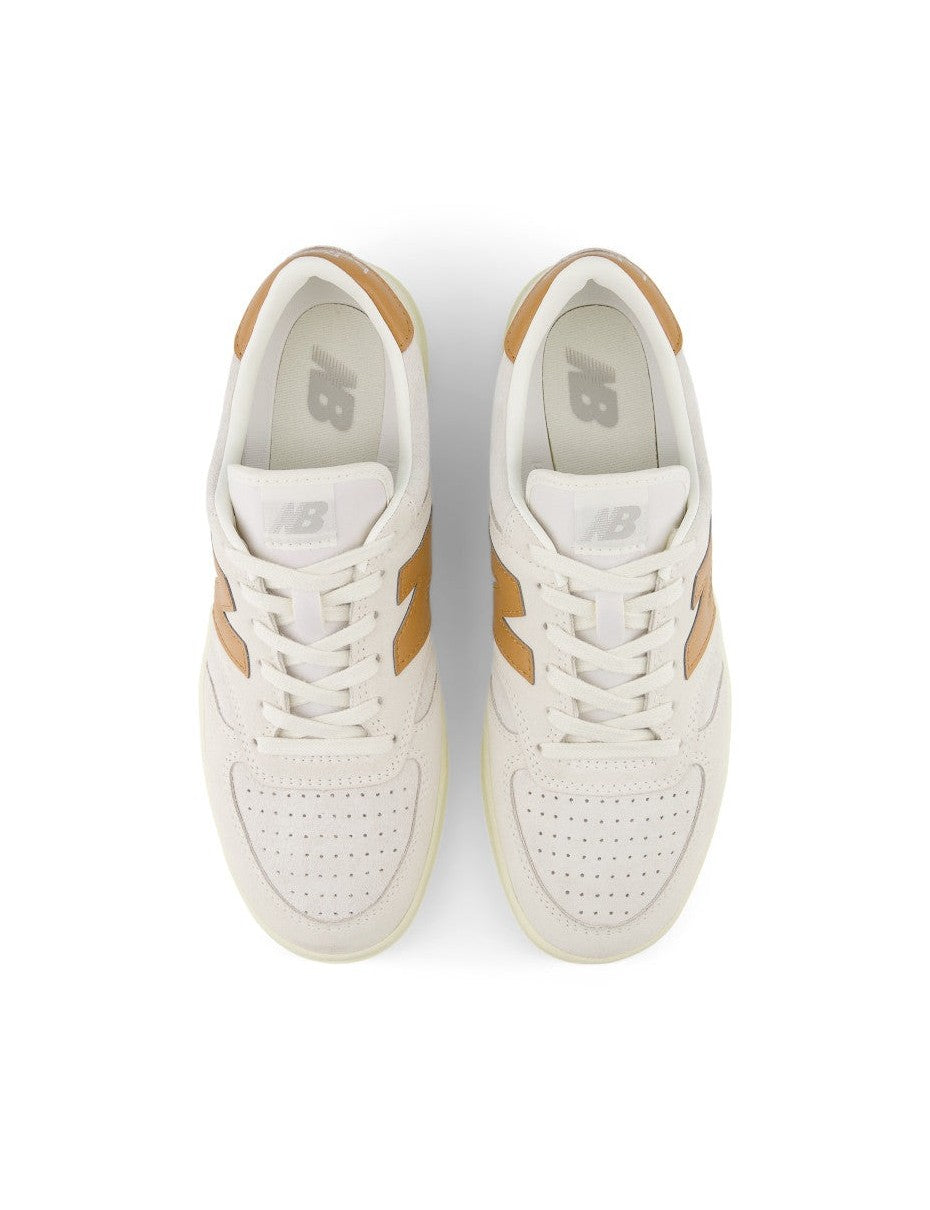 T500 sneakers featuring a blend of pigskin suede and nubuck, with perforated toebox detailing and a clean white colorway, embodying timeless style and premium quality since 1982.


