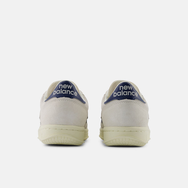 T500 sneakers featuring a blend of pigskin suede and nubuck, with perforated toebox detailing and a clean white colorway, embodying timeless style and premium quality since 1982.


