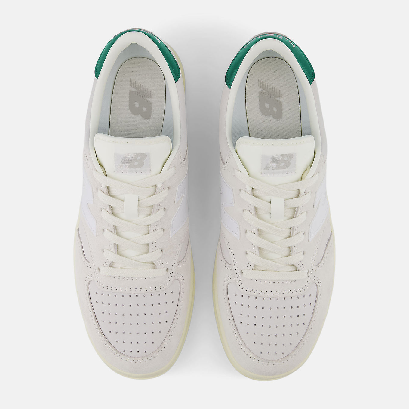 CT500 sneakers featuring a blend of pigskin suede and nubuck, with perforated toebox detailing and a clean white colorway, embodying timeless style and premium quality since 1982.


