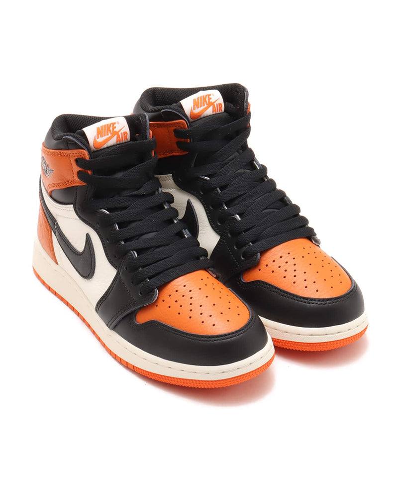 Air Jordan 1 "Shattered Backboard" sneakers with bold orange, black, and white tumbled leather design inspired by MJ’s iconic 1985 dunk in Italy.