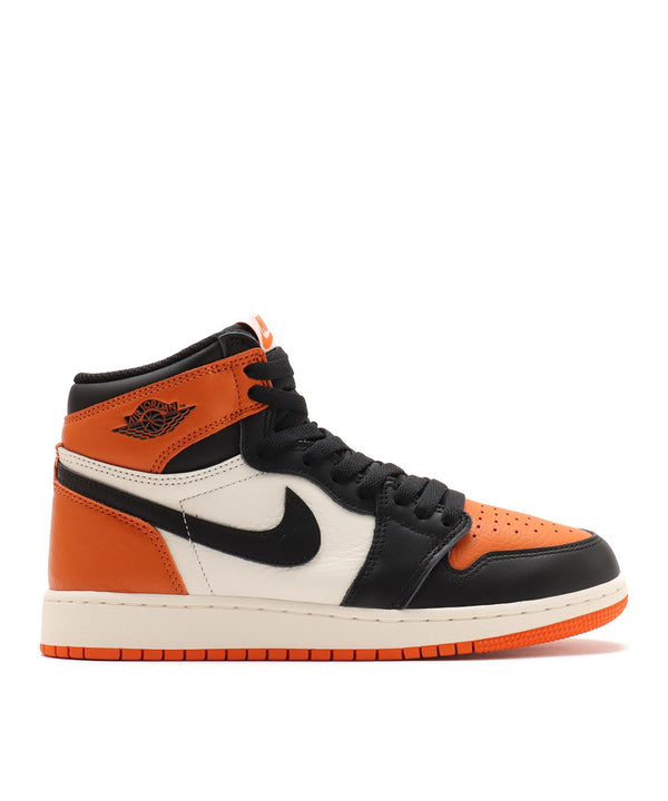 Air Jordan 1 "Shattered Backboard" sneakers with bold orange, black, and white tumbled leather design inspired by MJ’s iconic 1985 dunk in Italy.