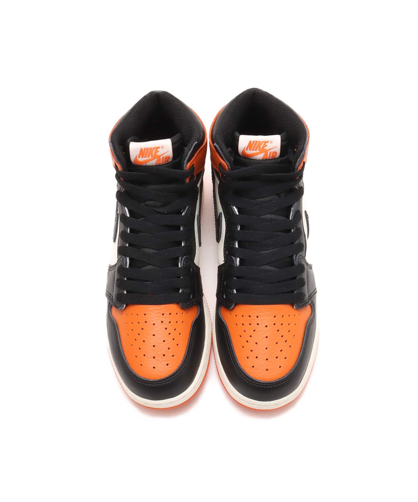 Air Jordan 1 "Shattered Backboard" sneakers with bold orange, black, and white tumbled leather design inspired by MJ’s iconic 1985 dunk in Italy.