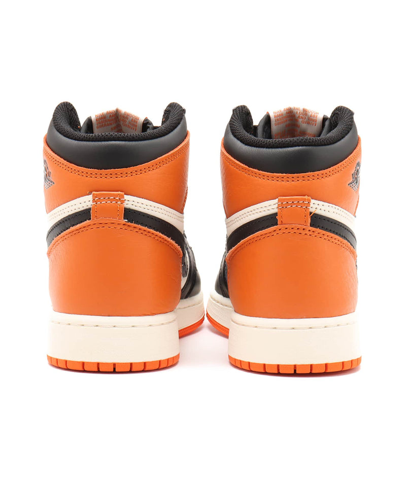 Air Jordan 1 "Shattered Backboard" sneakers with bold orange, black, and white tumbled leather design inspired by MJ’s iconic 1985 dunk in Italy.