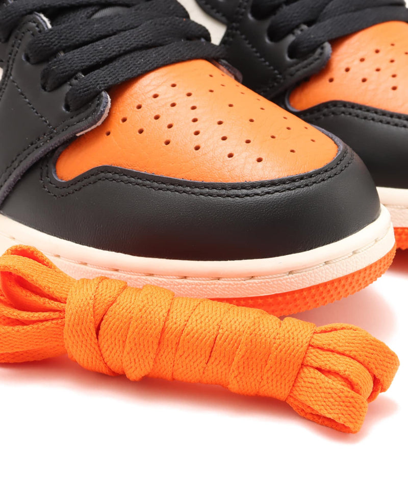 Air Jordan 1 "Shattered Backboard" sneakers with bold orange, black, and white tumbled leather design inspired by MJ’s iconic 1985 dunk in Italy.