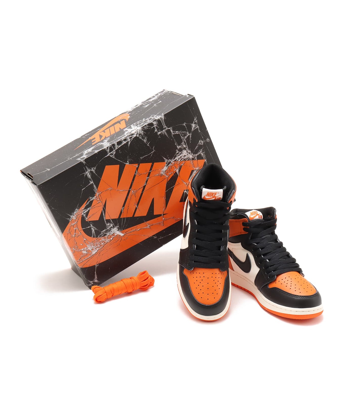 Air Jordan 1 "Shattered Backboard" sneakers with bold orange, black, and white tumbled leather design inspired by MJ’s iconic 1985 dunk in Italy.