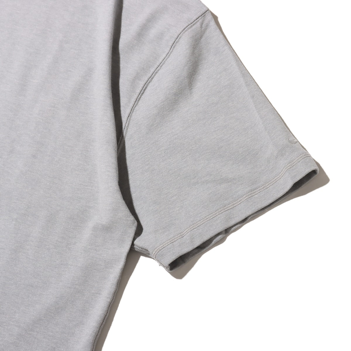 Classic wool-cotton blend tee with slightly loose fit and tonal logo, offering casual style and comfort for everyday wear.