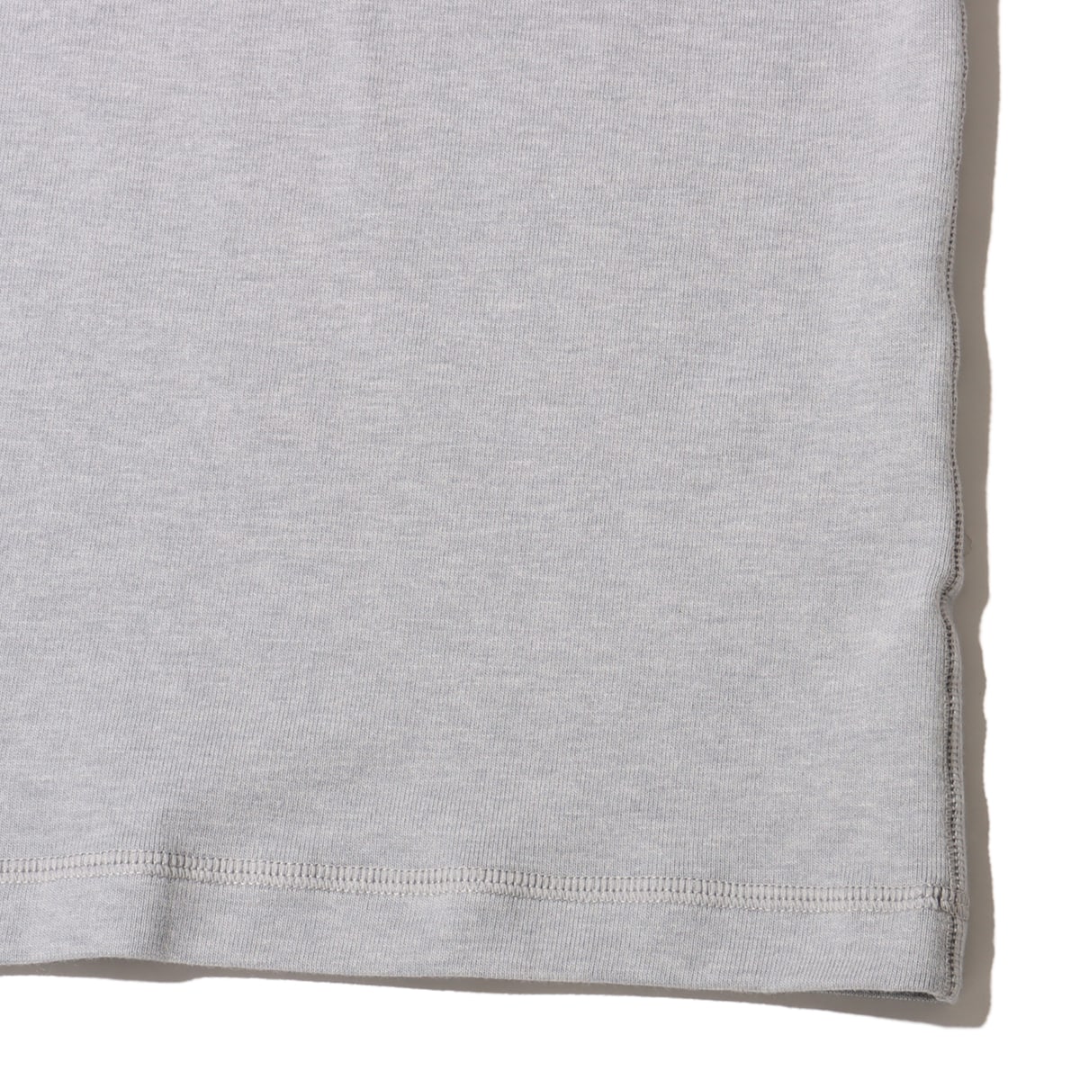 Classic wool-cotton blend tee with slightly loose fit and tonal logo, offering casual style and comfort for everyday wear.