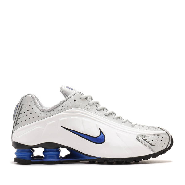 Nike Shox R4 sneaker with futuristic design lines, Shox column in the heel, and bold street-ready style.