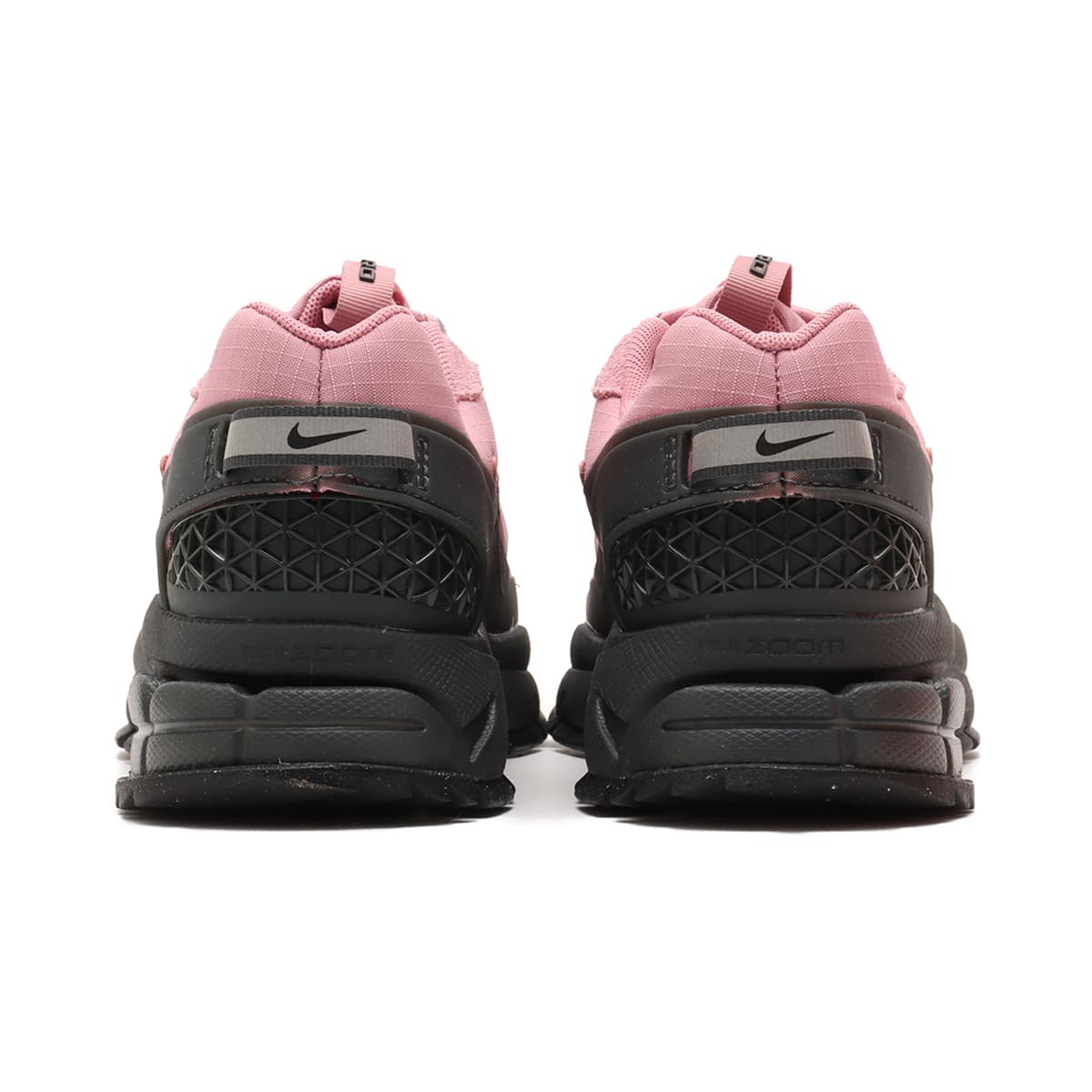 Nike Zoom Vomero 5 winter edition with water-repellent fabric, rubber mudguard, adjustable lace toggles, and cushioned midsole for all-weather comfort.