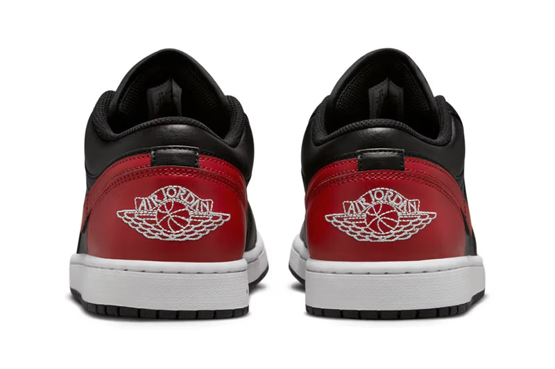 Air Jordan 1 Low "Bred" with black leather upper, red accents on the toe box, Swooshes, and heels, and black nylon tongues, combining classic design with modern comfort.