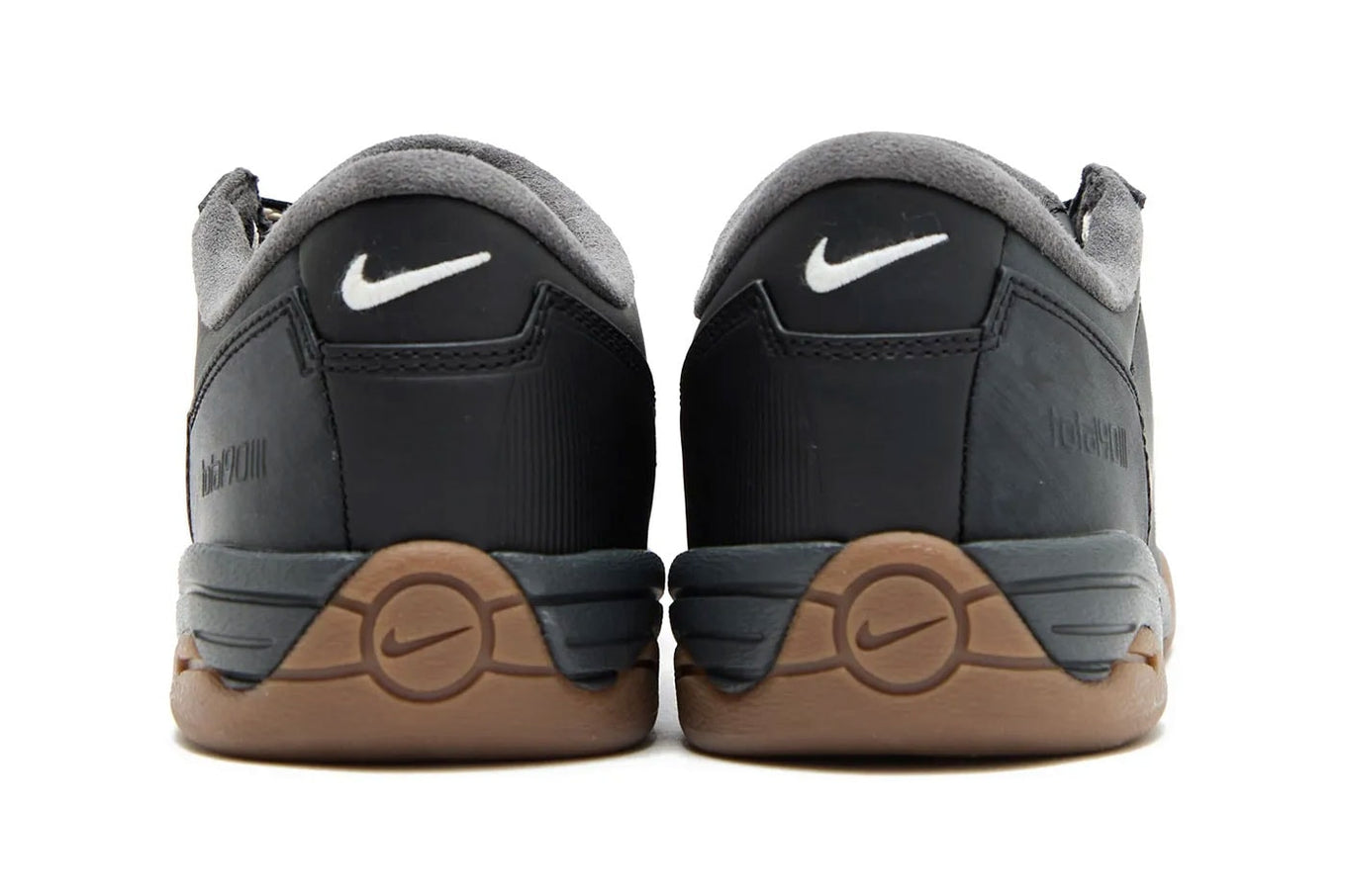 Modern Nike Total 90 with white jacquard upper, black accents, gum sole, and iconic asymmetrical lacing