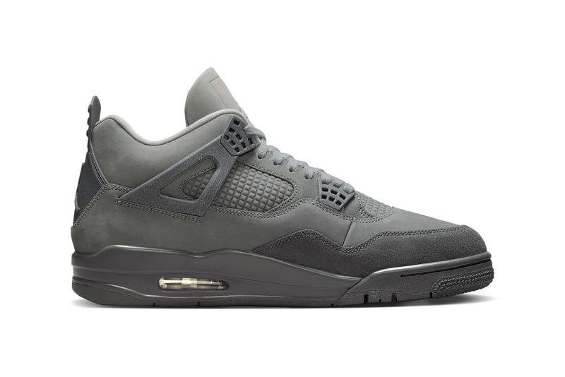 AJ4 'Wet Cement' sneaker in grey with nubuck leather and suede, inspired by Parisian cobblestone streets. The shoe showcases a rustic yet refined look, suitable for any urban setting.