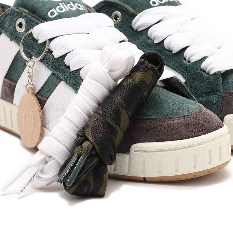 BAPE x adidas 30th Anniversary city sneaker with leather upper, rubber outsole, and hidden pocket in the shoe tongue.