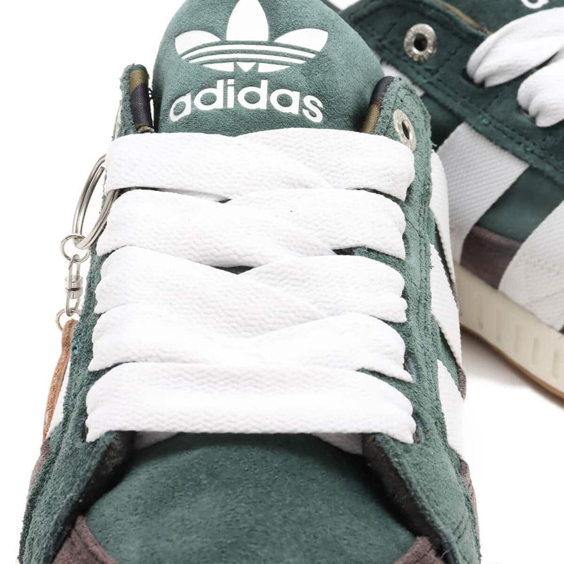 BAPE x adidas 30th Anniversary city sneaker with leather upper, rubber outsole, and hidden pocket in the shoe tongue.