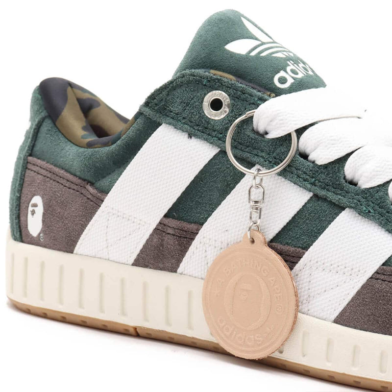 BAPE x adidas 30th Anniversary city sneaker with leather upper, rubber outsole, and hidden pocket in the shoe tongue.