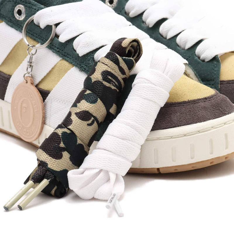 BAPE x adidas 30th Anniversary city sneaker with leather upper, rubber outsole, and hidden pocket in the shoe tongue.