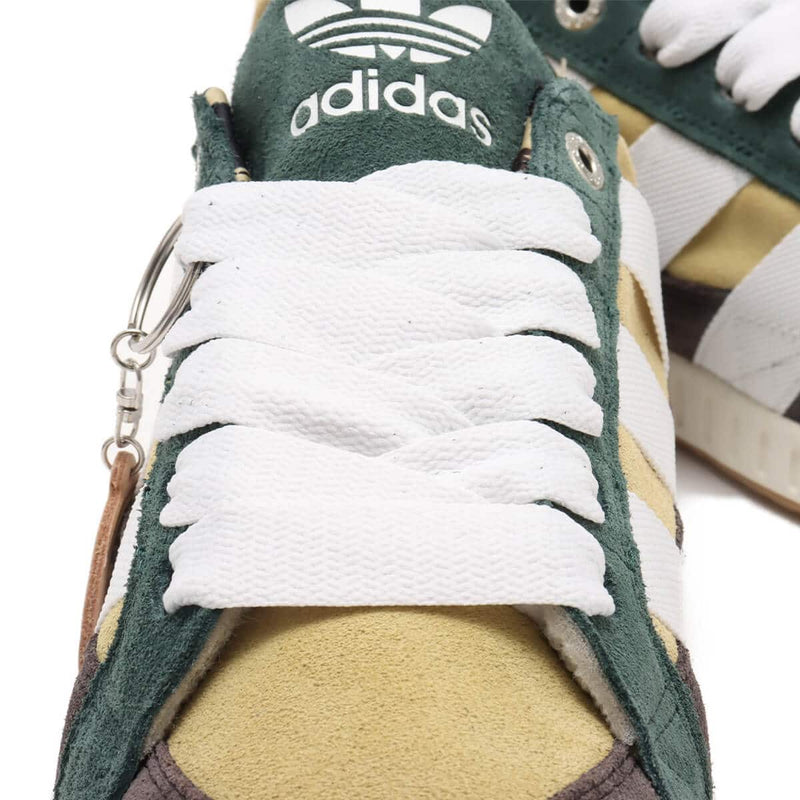 BAPE x adidas 30th Anniversary city sneaker with leather upper, rubber outsole, and hidden pocket in the shoe tongue.