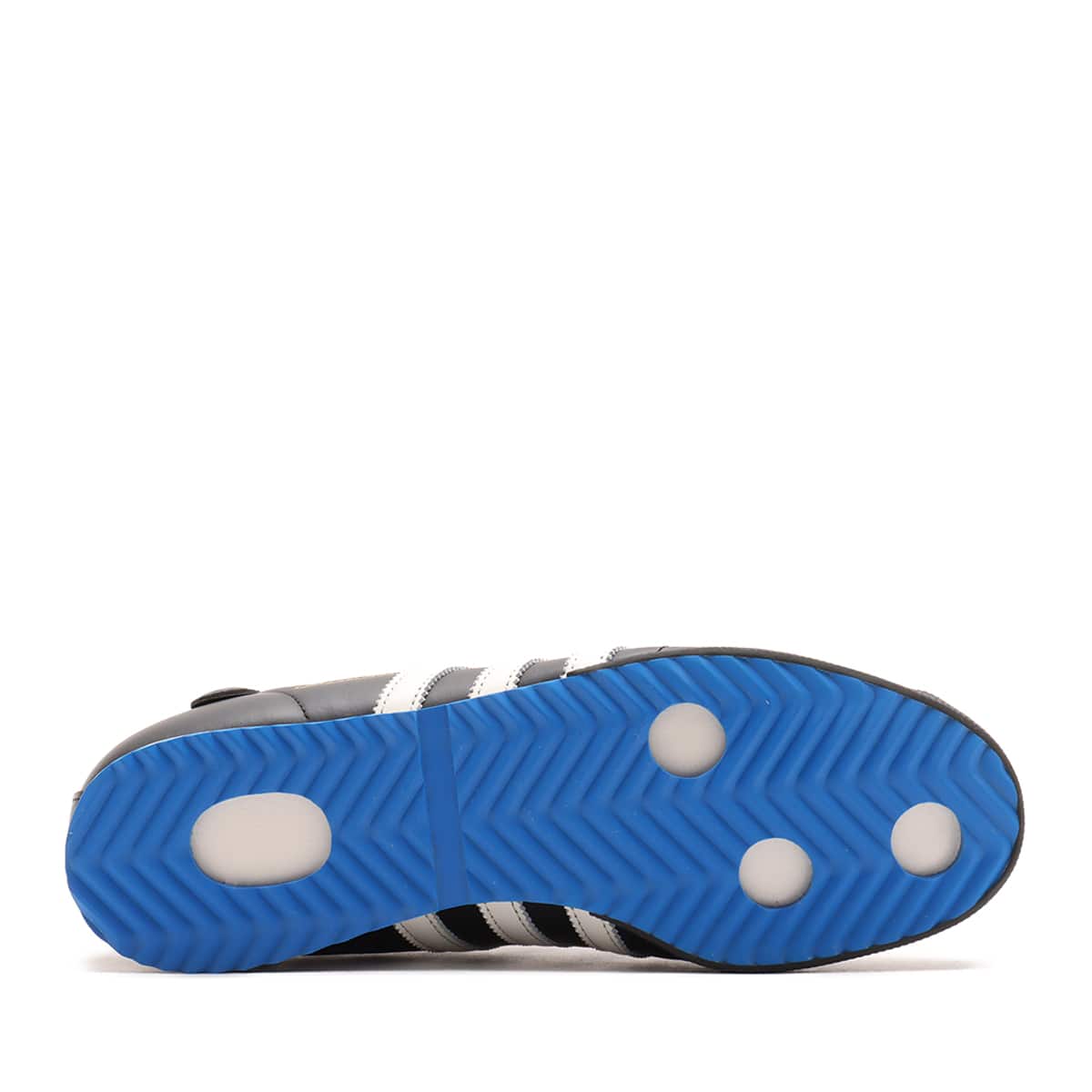 adidas Samba 62 Shoes with a leather upper, rubber toe bumper, wedge sole, and jagged 3-Stripes, inspired by 1960s football heritage.