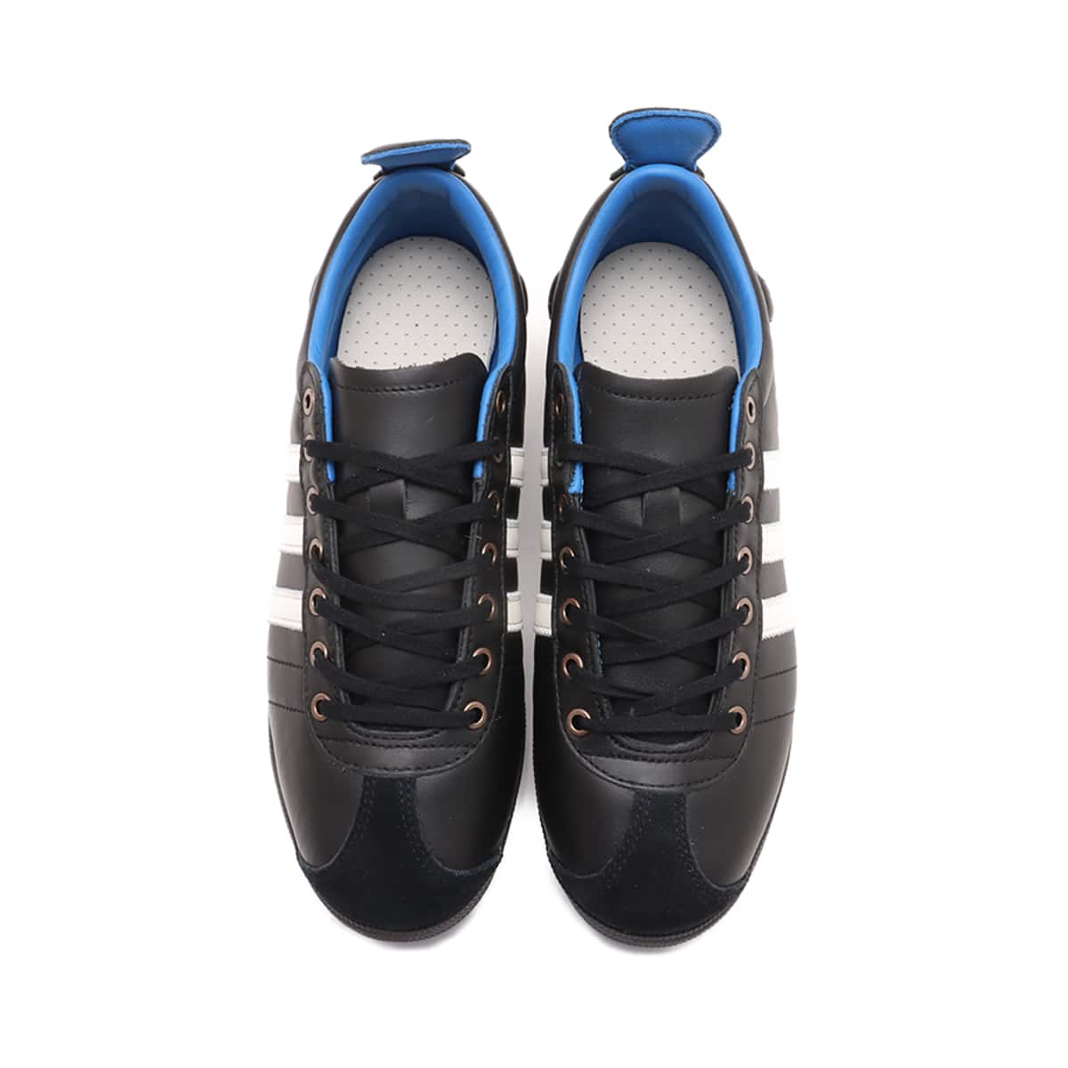 adidas Samba 62 Shoes with a leather upper, rubber toe bumper, wedge sole, and jagged 3-Stripes, inspired by 1960s football heritage.