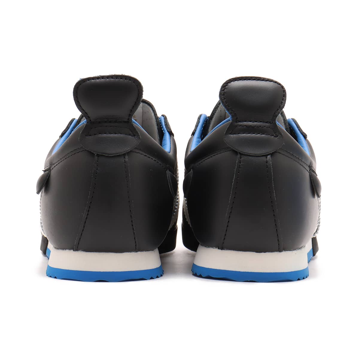 adidas Samba 62 Shoes with a leather upper, rubber toe bumper, wedge sole, and jagged 3-Stripes, inspired by 1960s football heritage.