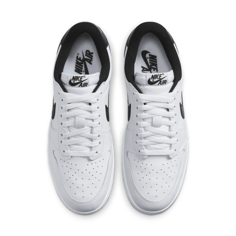 Air Jordan 1 Low '85 Metallic Black - White leather with metallic black Swoosh, heel tab, and grey outsole.